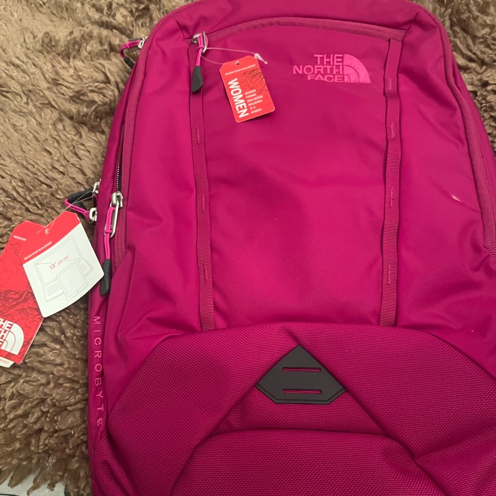 Brand new magenta North Face microbyte backpack. New with no tags, no wear.